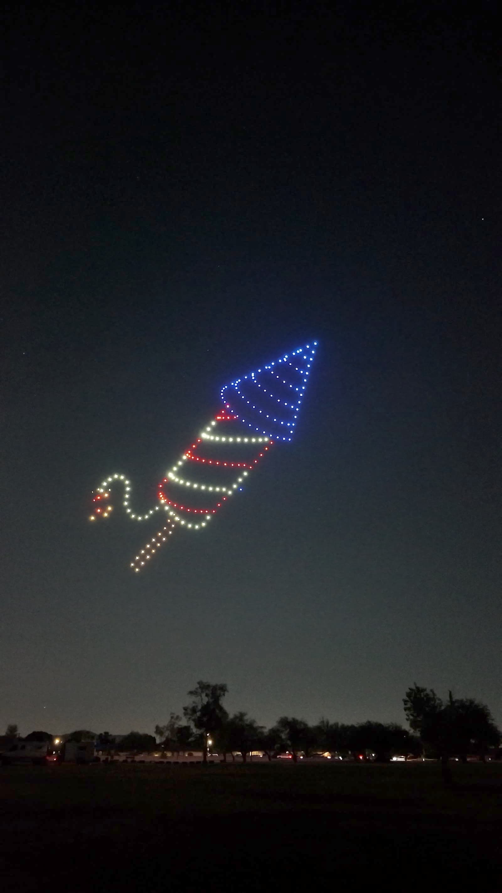 Red, white, and blue firecracker-shaped drone formation