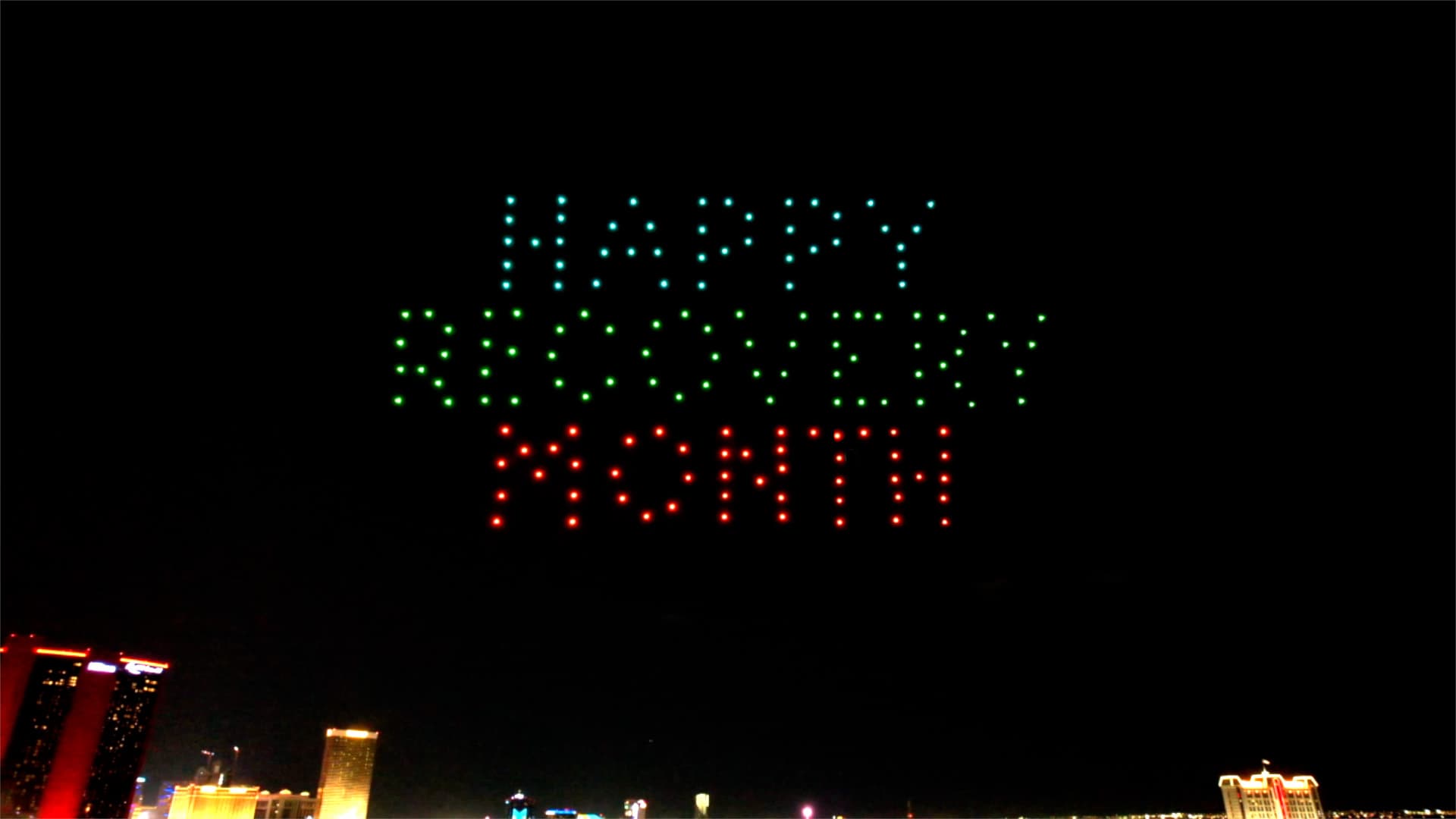 Drones spell Happy Recovery Month in blue, green and red above the Las Vegas skyline