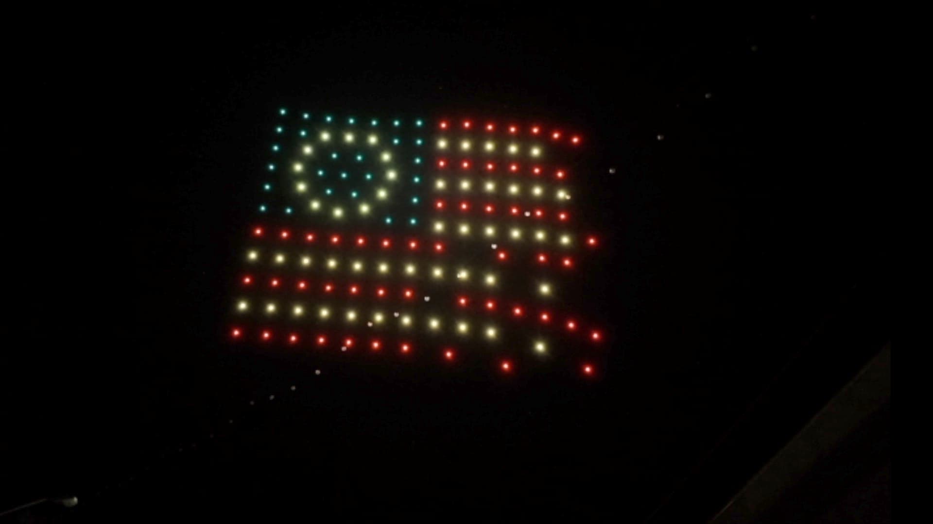 Drones form the American flag above Pioche at night
