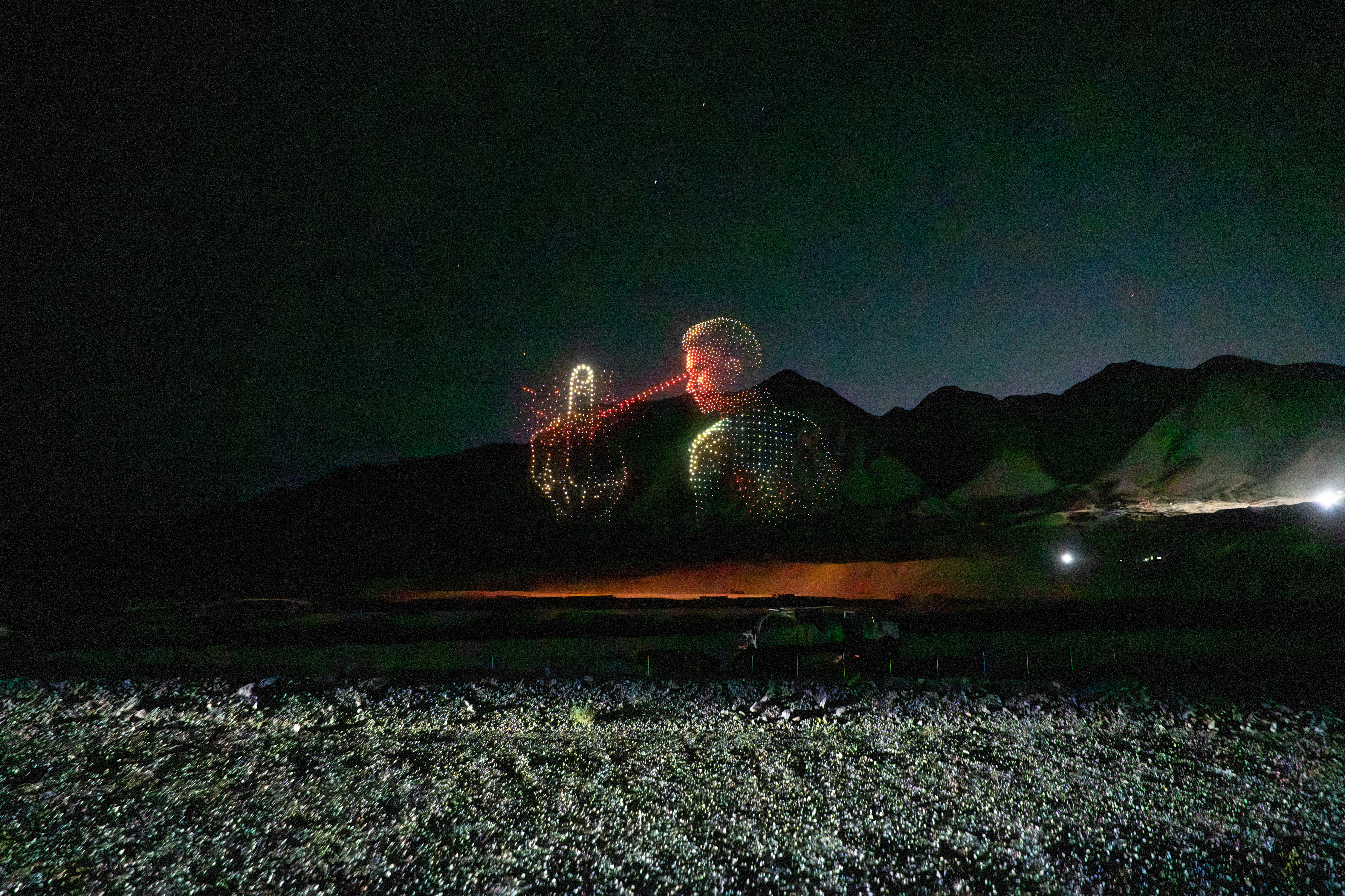 Drone formation of Homelander firing laser eyes at another aerial figure